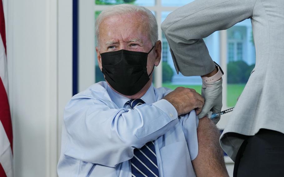 President Joe Biden receives a COVID-19 booster shot during an event in the South Court Auditorium on the White House campus, Monday, Sept. 27, 2021, in Washington. 