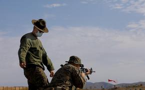 AUGUST 13, 2020, OCEANSIDE, CA, USA, Camp Pendleton At Camp Pendleton one of the shooting instructors observes recruit Garrett Glasson, 21, from Half Moon Bay, California. (Nelvin C. Cepeda / The San Diego Union-Tribune)
