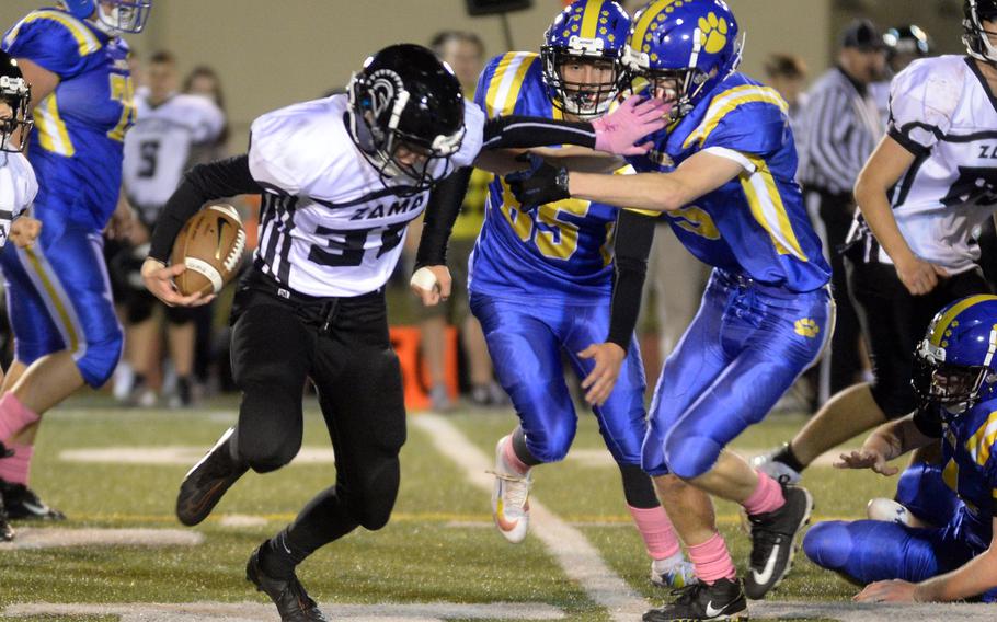 Zama back Tyler Deiwert tries to outrun Yokota defender Michael Kasten.