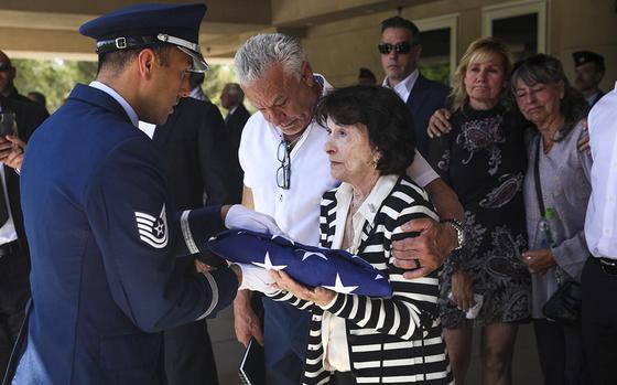 An Air Force member presents a flag to the late Air Force Col. James Abraham&#x2019;s wife, Jo Abraham, at his funeral at the Southern Nevada Veterans Memorial Cemetery in Boulder City, Nev., Monday, May 15, 2023. (Rachel Aston/Las Vegas Review-Journal) @rookie__rae