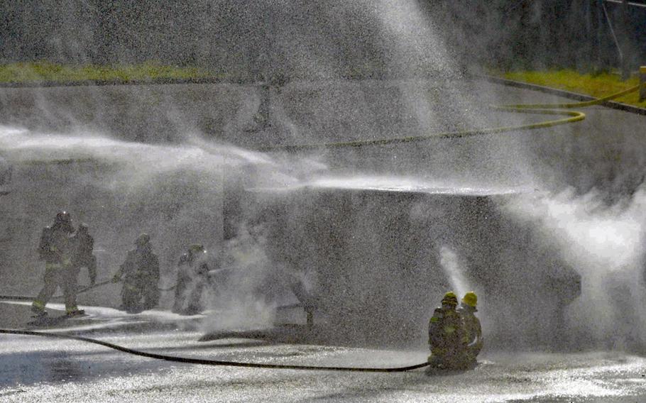 Marine Corps and Japanese first responders train to a handle a military helicopter crash at Camp Hansen, Okinawa, Thursday, Feb. 9, 2023.