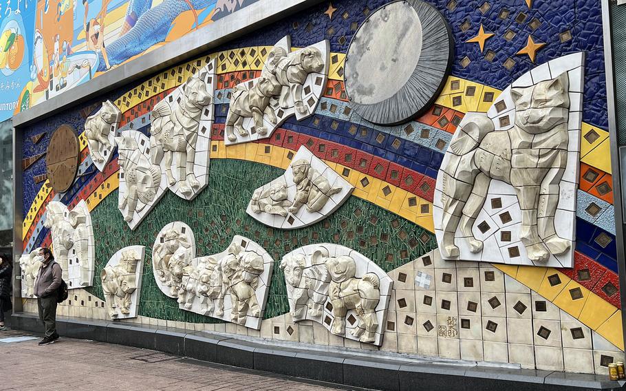 Near the Hachiko statue, outside Shibuya Station in Tokyo, is a massive piece of art dedicated to the loyal pooch.