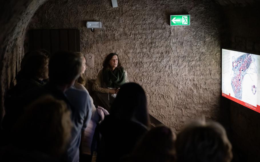 Tour guide Andrea Stephany takes English-speaking visitors through underground tunnels in central Kaiserslautern and explains the city’s history on Saturday, Nov. 5, 2022.