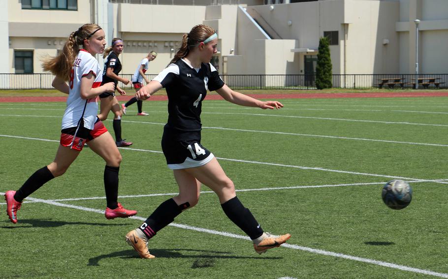 Bella Hunter sends the ball on its way.