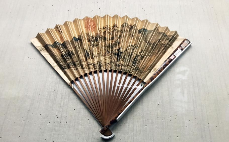 A golden fan is displayed at the National Palace Museum in Taiwan.