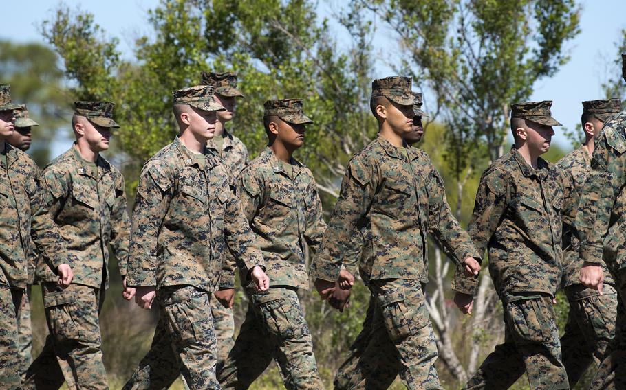 Marines practice marching during a field exercise at MacDill Air Force Base, Fla., in March 2018. 