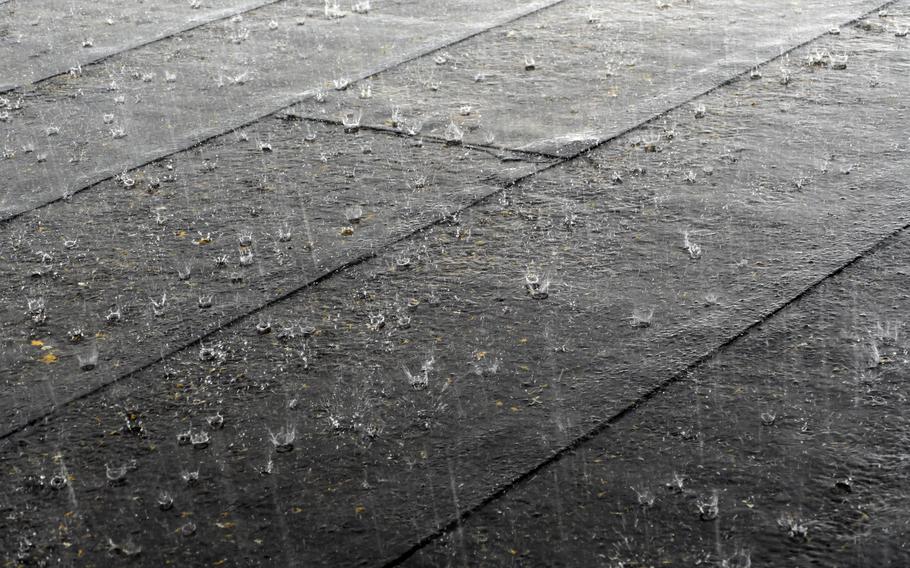 Hard rain on a roof covered with felt and tar paper.