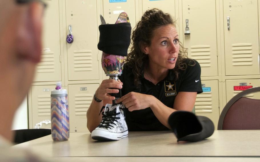 Triathlete Kelly Elmlinger, 42, of Attica, Ohio, spent seven years nursing wounded warriors at Brooke Army Medical Center in San Antonio. The Army veteran is now competing in the Tokyo Paralympics. 