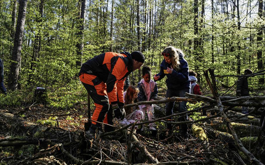 Jan Klein, a forester with Rheinland-Pfalz state, plants oak seedlings along Ramstein Air Base's new nature trail with Ramstein Elementary School students, April 23, 2024. Together, kids planted 250 trees.