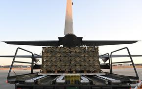 Pallets of ammunition are loaded onto an 86th Airlift Wing C-130J Super Hercules on Ramstein Air Base, Germany, Aug. 7, 2022. Air Mobility Command's global air mobility support system is critical to the Department of Defense’s ability to rapidly fulfill Ukraine’s priority security assistance requests. (U.S. Air Force photo by Capt. Emma Quirk)