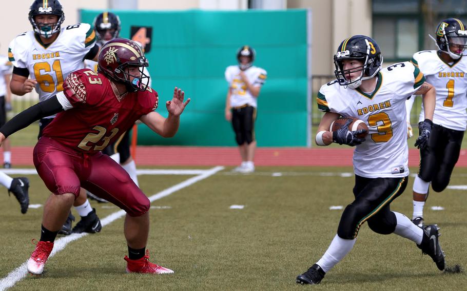 Robert D. Edgren's Daichi Goodson tries to elude Matthew C. Perry defender Maddix Larue.