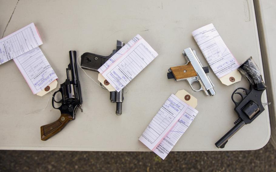 Fully processed guns that will later be destroyed sit on a table during a gun buyback exchange at Encanto Southern Baptist Church on  June 5, 2021. Unwanted pistols and rifles were exchanged for 00 and 00 gift cards.