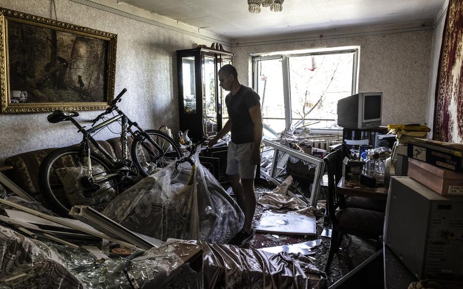 Artem Sannikov surveys his shattered apartment in Pidhorodne, a town outside Dnipro, Ukraine, that Russia attacked over the weekend. 