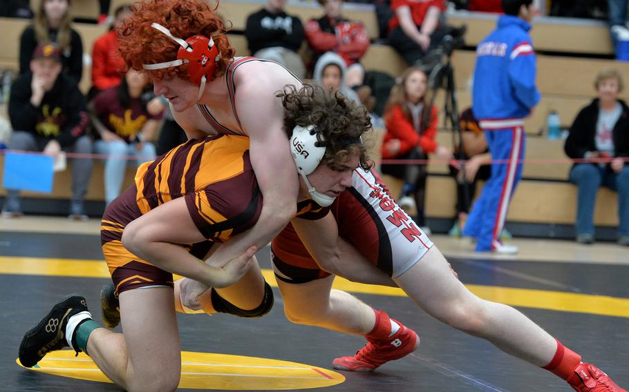 Vilseck’s Garrett Hyten, left, and Kaiserslautern’s Ryder Souder grapple in a first-round 175-pound match at the DODEA-Europe wrestling finals in Wiesbaden, Germany, Feb. 10, 2023. Hyten won.