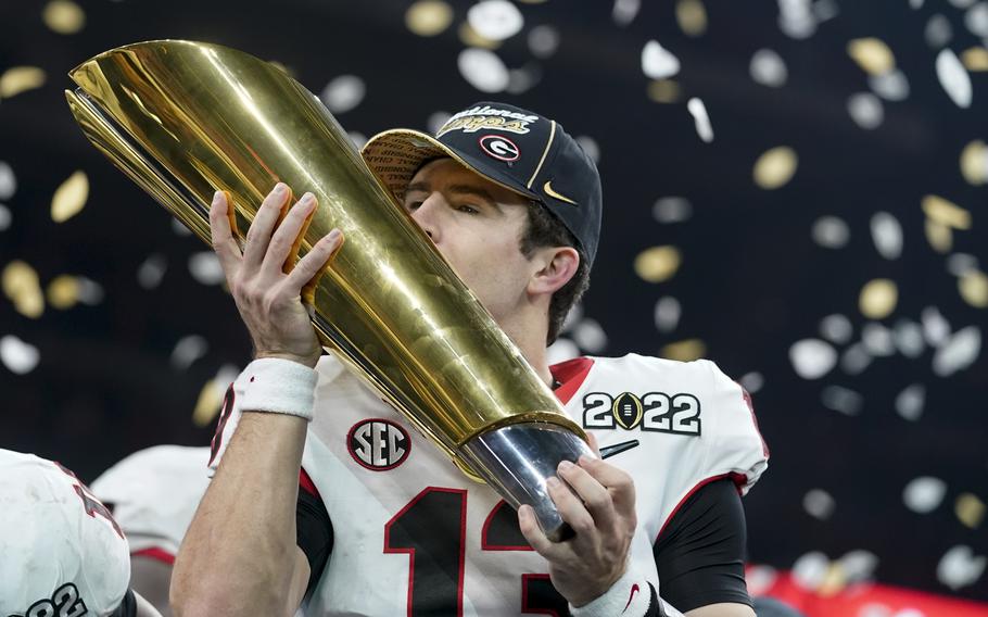 Georgia's Stetson Bennett celebrates after the College Football Playoff championship football game against Alabama Tuesday, Jan. 11, 2022, in Indianapolis. Georgia won 33-18. 