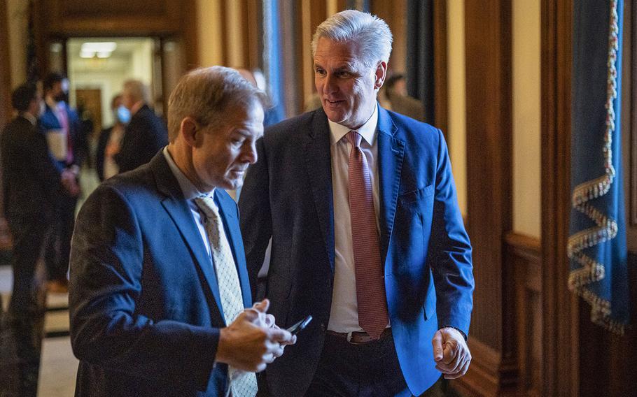 House Minority Leader Kevin McCarthy, R-Calif., speaks with Rep. Jim Jordan, R-Ohio, as they walk to a news conference about the Biden agenda on Capitol Hill on Nov. 17, 2021.