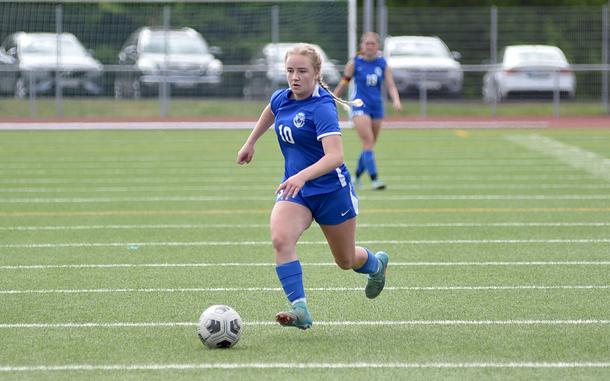 Ramstein striker Claire Boynton dribbles toward net during a May 3, 2025, match against Stuttgart at Ramstein High School on Ramstein Air Base, Germany.