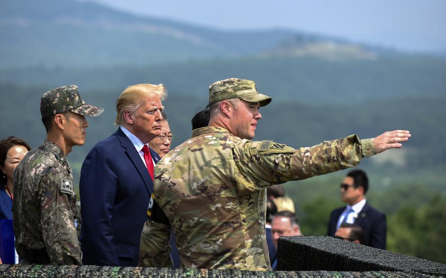 President Donald Trump looks at North Korea from Observation Post Oullette inside the Joint Security Area in Panmunjon, South Korea, June 30, 2019.