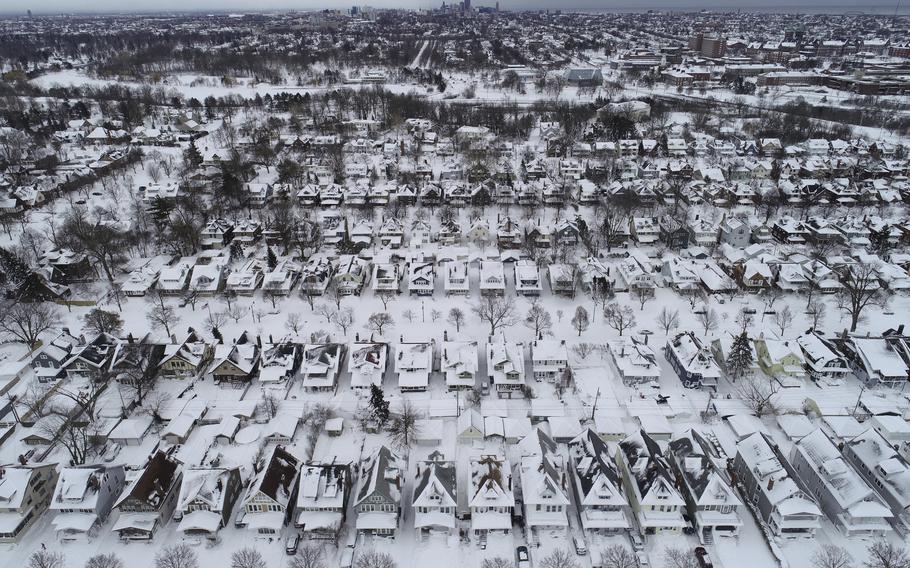 An aerial view of the 1901 Pan-American Exposition neighborhood in Buffalo, N.Y., which remains coated in a blanket of snow after a blizzard, Tuesday, Dec. 27, 2022. State and military police were sent Tuesday to keep people off Buffalo’s snow-choked roads, and officials kept counting fatalities three days after western New York’s deadliest storm in at least two generations. 