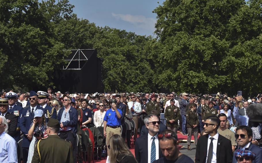 Visitors gather before the start of the D-Day 80th anniversary commemoration at Normandy American Cemetery in Colleville-sur-Mer, France, June 6, 2024.