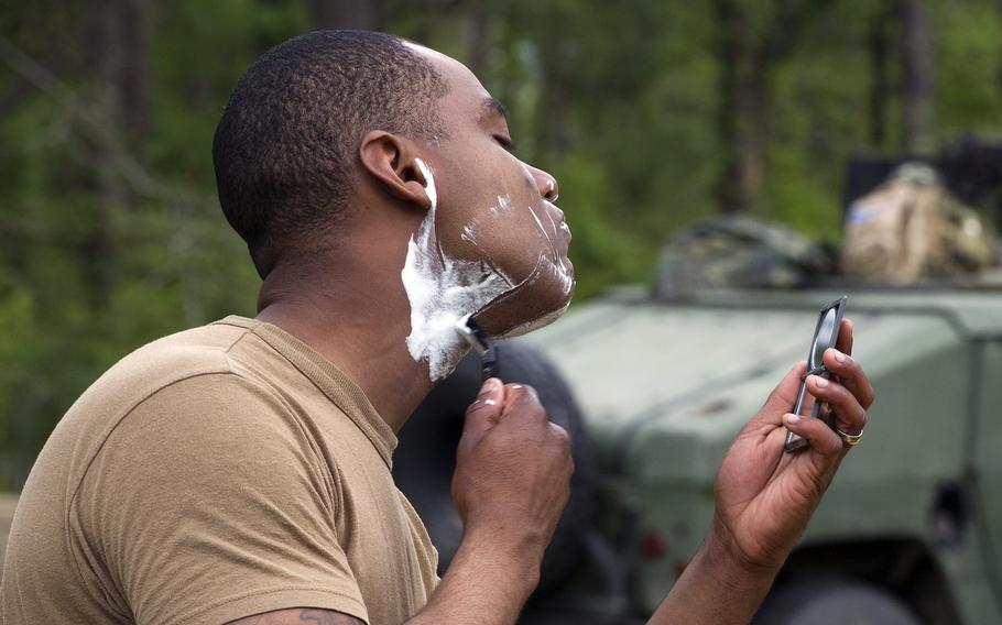 A sailor shaves during an exercise in 2012 at Camp Shelby, Miss. The Navy says it no longer will separate sailors who have documented cases of pseudofolliculitis barbae, commonly known as razor bumps. 