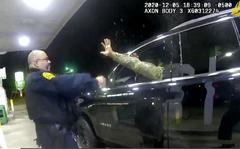FILE - In this image taken from a Windsor, Va., Police video, a police officer uses a spray agent on Caron Nazario, an Army lieutenant who is Black and Latino, on Dec. 20, 2020, in Windsor, Va. The traffic stop from December 2020 was captured on video and viewed by millions of people after it became public in April 2021. Nazario can proceed to trial with claims in a lawsuit of false imprisonment, assault and battery under state law, a federal judge ruled Tuesday, Aug. 9, 2022. (Windsor Police via AP, File)