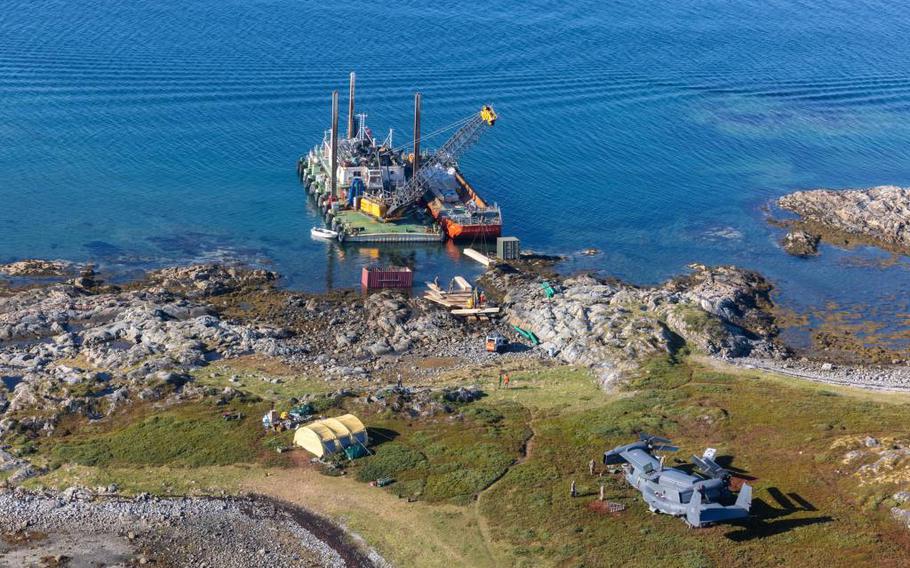 The U.S. Air Force CV-22 Osprey near the water in the Stongodden Nature Reserve, Norway, after an emergency landing in August. Too far from shore to be reached by crane and away from roads, the aircraft had to be moved closer to the water's edge via a makeshift ramp. 