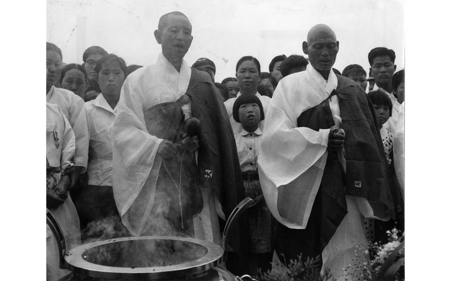 Monks lead the faithful in prayers for soldiers.