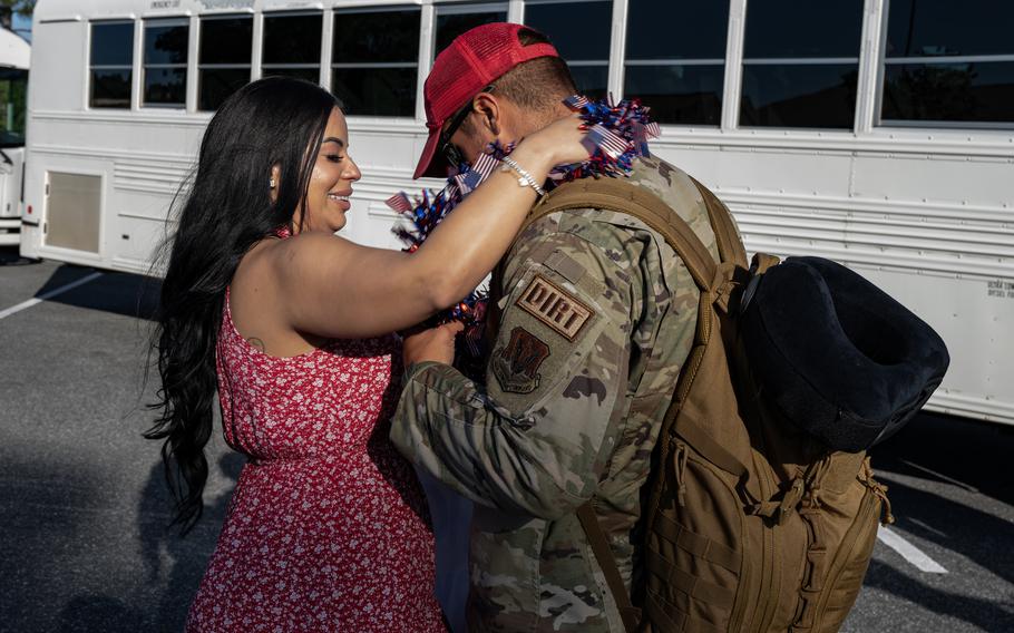 A U.S. Air Force airman assigned to the 823rd Rapid Engineer Deployable Heavy Operational Repair Squadron Engineer reunites with his family at Hurlburt Field, Fla., Sunday, April 14, 2024. 