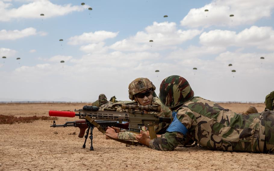 A 173rd Infantry Brigade soldier discusses drop zone security with a Moroccan soldier in Ben Guerir, Morocco, June 10, 2023 during Exercise African Lion 23. Approximately 8,000 personnel and 18 nations are participating in U.S. Africa Command's largest annual exercise.