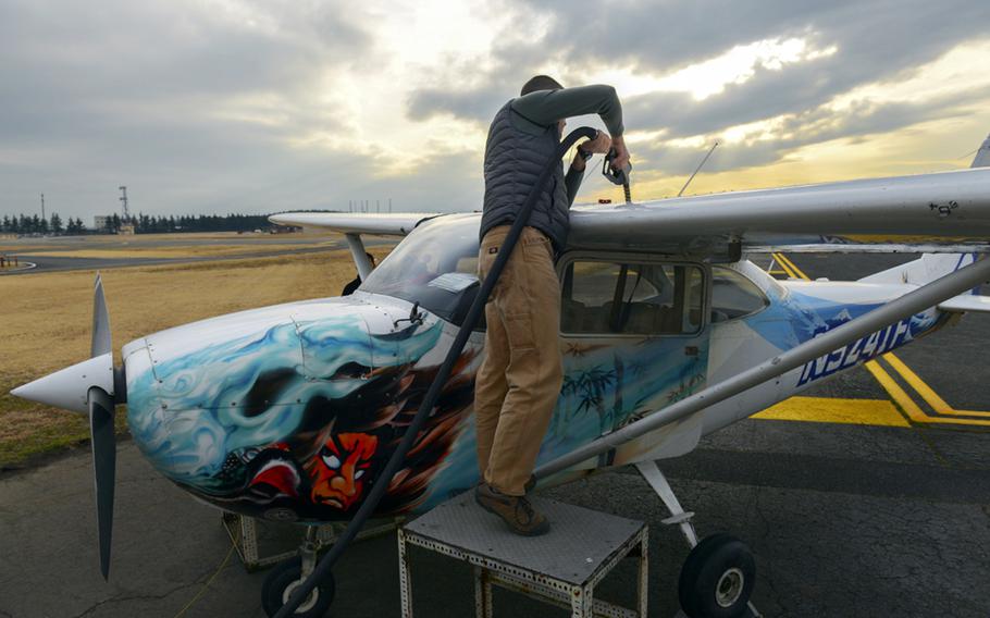 Then-Lt. Col Andrew Campbell fuels up a Cessna 172 while working on his single-engine pilot's license through the Aero Club at Yokota Air Base, Japan, in February 2016. 