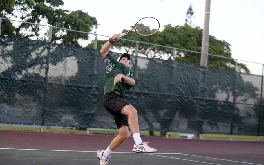 Kubasaki's Owen Ruksc reaches up to hit an overhead return.