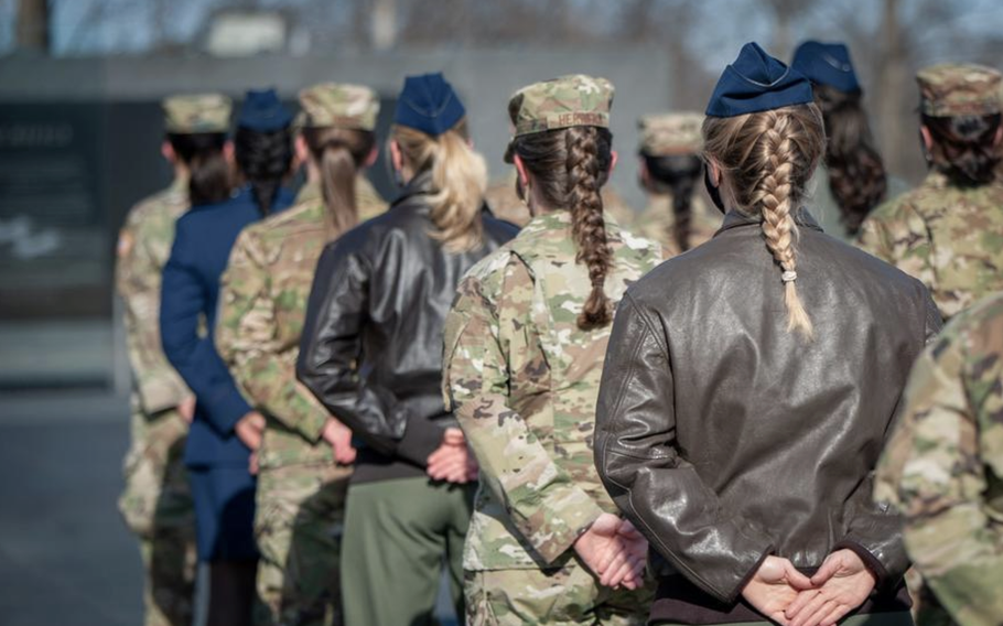 Female service members shown from the back in formation.