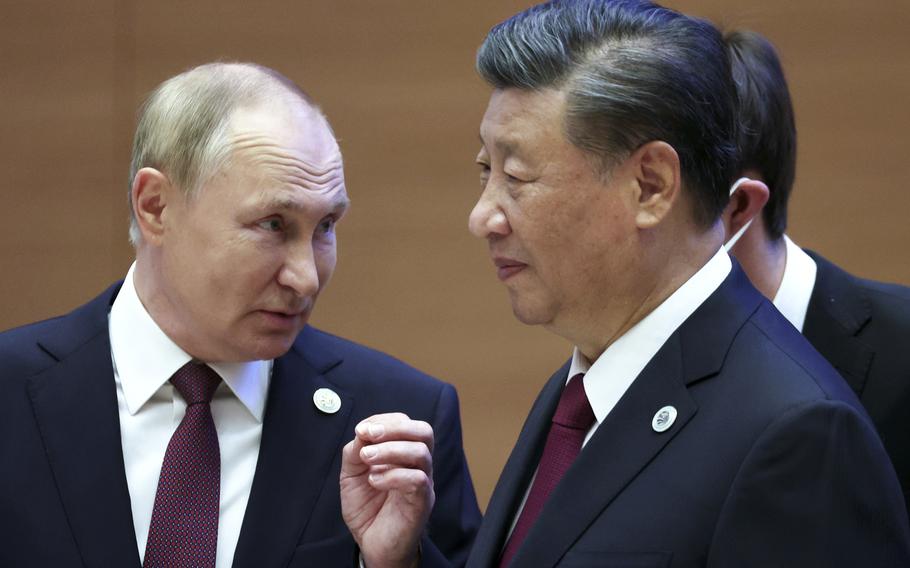 Russian President Vladimir Putin, left, gestures while speaking to Chinese President Xi Jinping during the Shanghai Cooperation Organization (SCO) summit in Samarkand, Uzbekistan, Sept. 16, 2022. China said Friday, March 17, 2023, President Xi will visit Russia from Monday, March 20, to Wednesday, March 22, 2023, in an apparent show of support for Russian President Putin amid sharpening east-west tensions over the conflict in Ukraine.