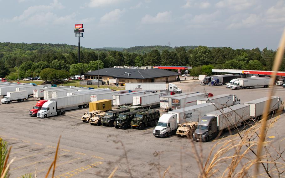 Marines stage vehicles at a truck stop near Tuscaloosa, Ala., May 3, 2021. Marines in tactical vehicles and trucks drove from Camp Lejeune, N.C., to Twentynine Palms, Calif., in one of the longest convoys in the service's history.