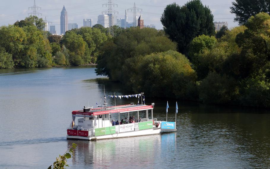A pedestrian and bicycle ferry crosses the Main River at Hoechst, a borough of Frankfurt downstream from the city’s skyscrapers.