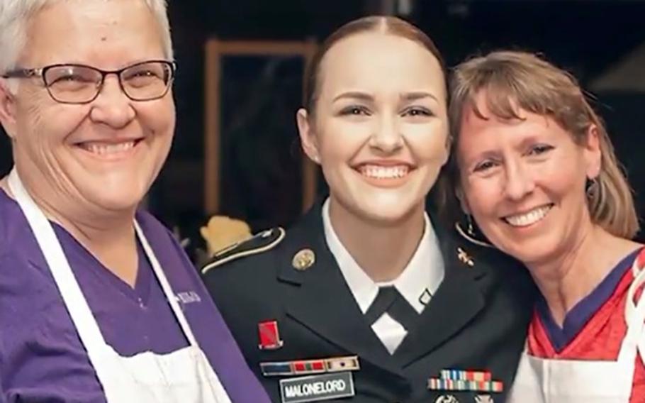 Cpl. Emma Malonelord poses with her two mothers in this screenshot from an Army recruiting video. Army leaders praised Malonelord after a mashup of the soldier's video was criticized by Sen. Ted Cruz on Twitter. 

U.S. Army