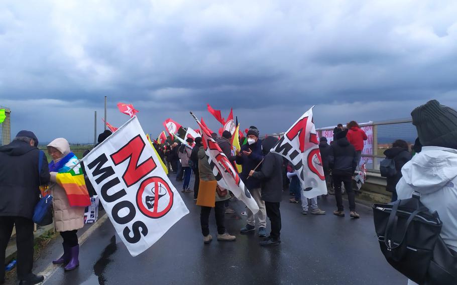 Demonstrators with the Italian group No Muos protest outside Naval Air Station Sigonella, Italy, on March 20, 2022. The protest temporarily blocked one access road to the base but did not disrupt base operations, officials said Monday.