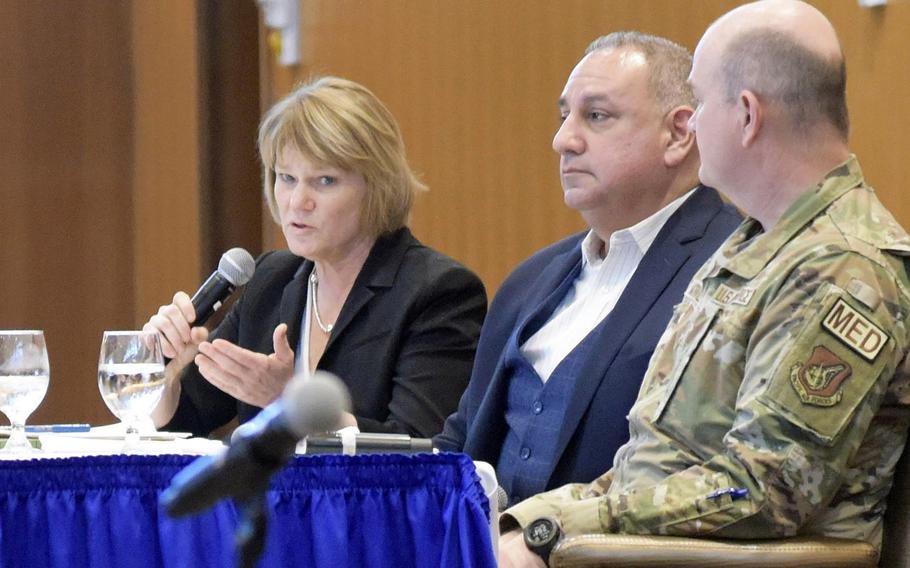 Seileen Mullen, left, acting assistant secretary of defense for health affairs; Gilbert Cisneros Jr., center, undersecretary of defense for personnel and readiness; and Col. John McFarlane, 18th Medical Group commander, answer questions about civilians’ access to medical care at Kadena Air Force Base, Okinawa, Feb. 1, 2023. 