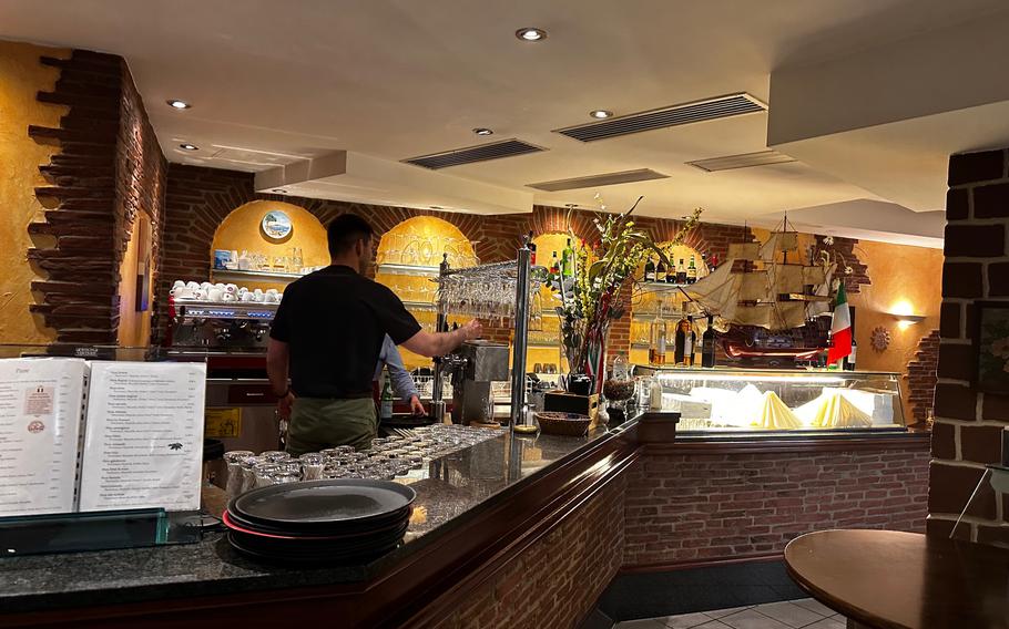 The inside of Osteria La Toscana restaurant in Weiden, Germany is warm and cozy.