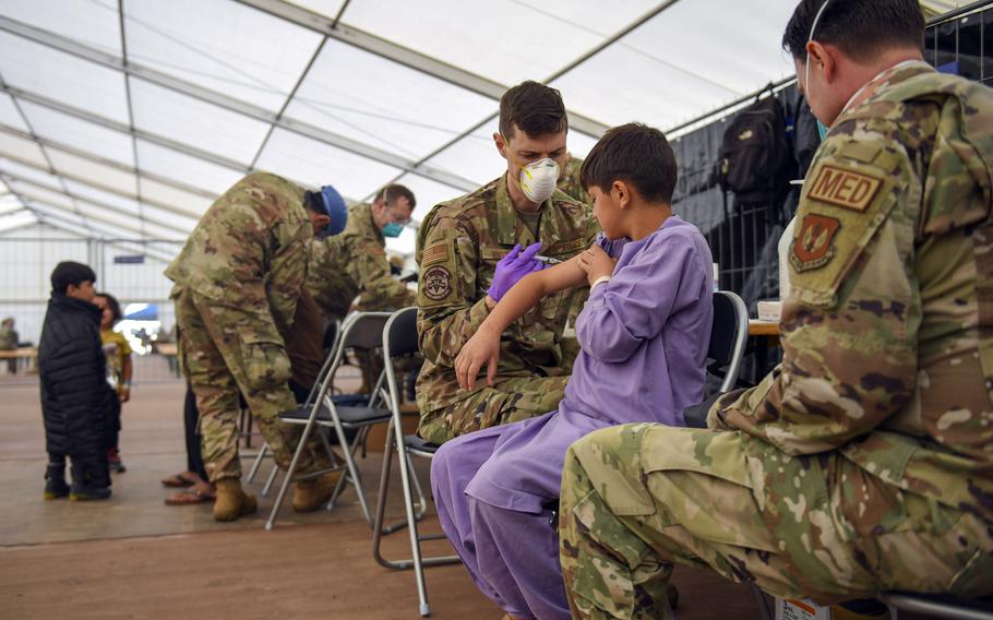 Airmen assigned to the 86th Medical Group administer the mumps, measles and rubella, and chickenpox vaccines to an Afghan evacuee at Ramstein Air Base, Germany, Sept. 18, 2021.The Centers for Disease Control and Prevention wants  evacuees inoculated against measles recently at U.S. military bases overseas to wait three weeks before traveling to the U.S., the agency said.