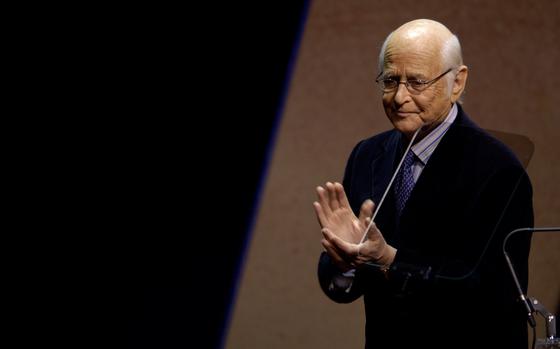 Producer Norman Lear, founder of People For the American Way, gives congratulatory applause to actress Sharon Stone (not shown) as he presents her with the Spirit of Liberty Award in the Terrace Theater at the John F. Kennedy Center for the Performing Arts on Dec. 6, 2005, in Washington, D.C. (Chris Greenberg/Getty Images/TNS)