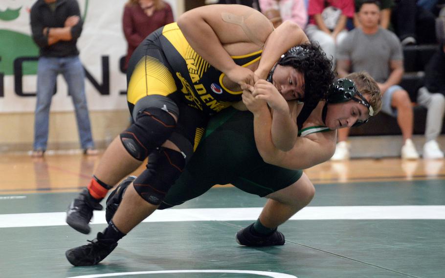 Kubasaki's Anthony Finegan, in green, placed third at heavyweight last year.