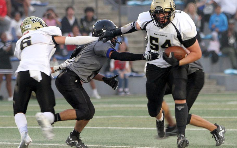 Humphreys' Ethan Elliott bursts upfield past teammate Ayden Watts and Osan's Anthony Waight-Forrester