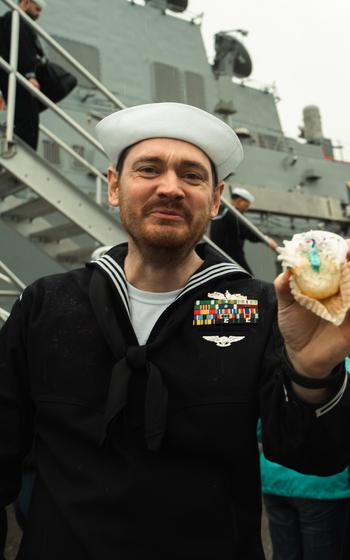 A USS Delbert D. Black sailor enjoys a cupcake after returning to Naval Station Mayport, Fla., on Sunday, Feb. 18, 2024.