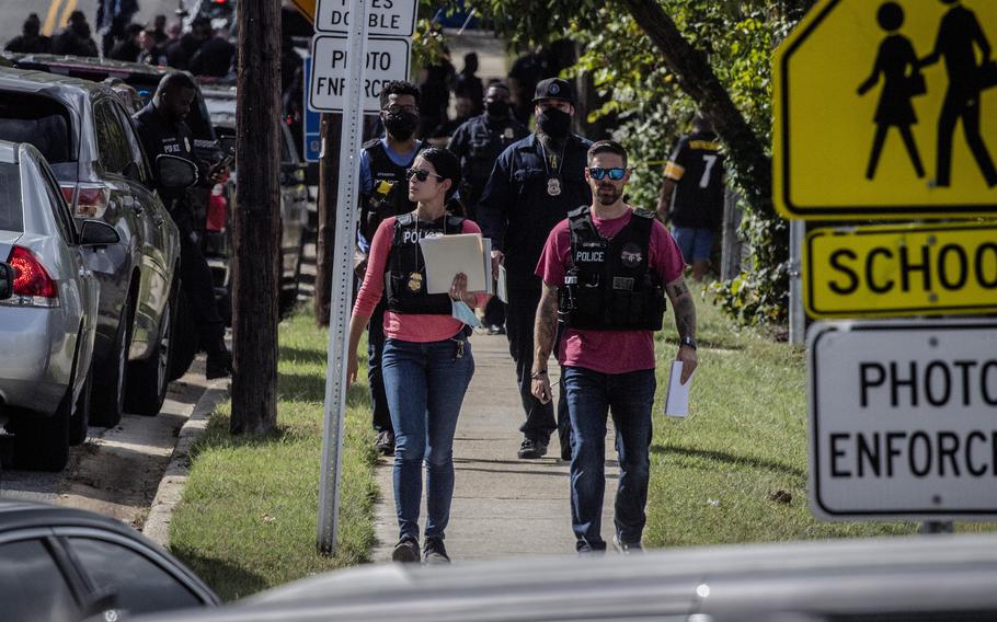 Police arrive at the scene of a shooting at a senior housing apartment on Friday, Oct. 8, 2021 in Capitol Heights, Md.