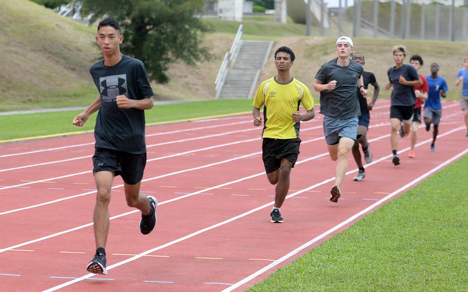 Joseph Dluzeski left leads the pack during Wednesday’s practice at Kadena. Dluzeski is unbeaten in four meets on Okinawa and holds the second-fastest time among DODEA-Pacific runners this year.