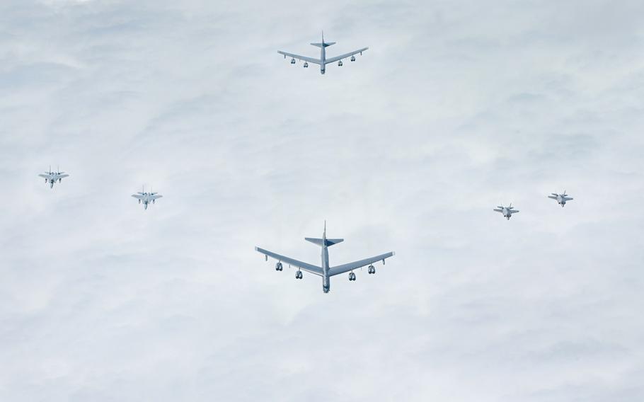 A pair of F-35A Lightning IIs from the 354th Fighter Wing, two B-52s from the 96th Expeditionary Bomb Squadron and two Japan Air Self-Defense Force F-15s fly together near Japan on Feb. 24, 2022.