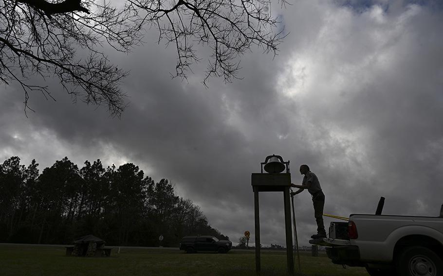 National Park Service employee Ronald Hobkirk works on a bell at the Jimmy Carter Boyhood Farm. 