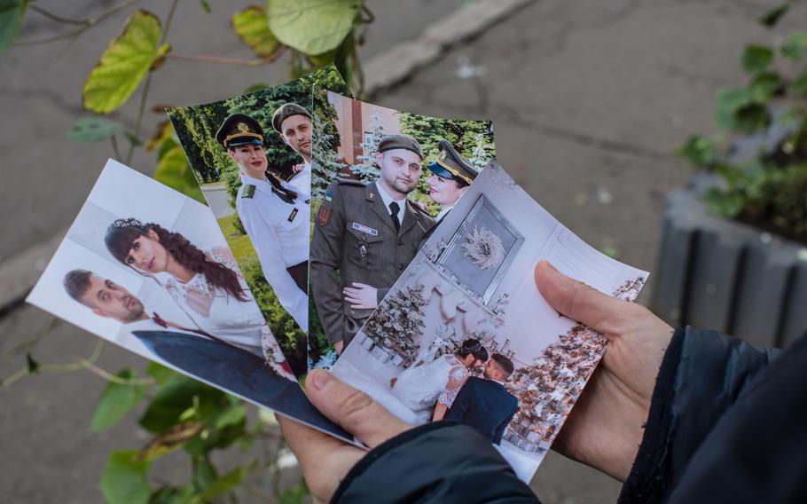 Olha Shapkova, 28, shows photos from the marriage with her husband military medic Volodymyr Shapko, who has been prisoner, in Kyiv on Sept. 25, 2022. Olha's husband Volodymyr is a military medic and is held prisoner supposedly in Olenivka.